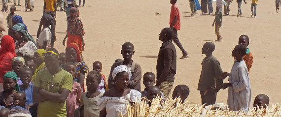 In this photo taken on Wednesday, Feb. 25, 2015,  refugees that fled their homes due to violence from the Islamic extremists group Boko Haram inside a refugee camp in  Minawao, Cameroon. Cameroon officials say prisons are overcrowded with suspected Islamic extremists whose insurgency has spilled from Nigeria. (AP Photo/Edwin Kindzeka Moki)