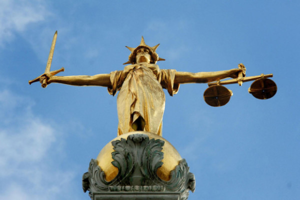 The statue on top of the Central Criminal Court, also referred to as Old Bailey, in London (Picture: PA)