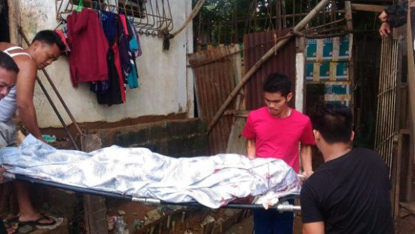 The body of drug suspect Jack Bertulfo is being taken out of his house after the Olongapo City police shot him dead when he tried to engage cops searching his house in a gunfight on Wednesday (July 13, 2016) afternoon. Photo from the Olongapo City Police Office