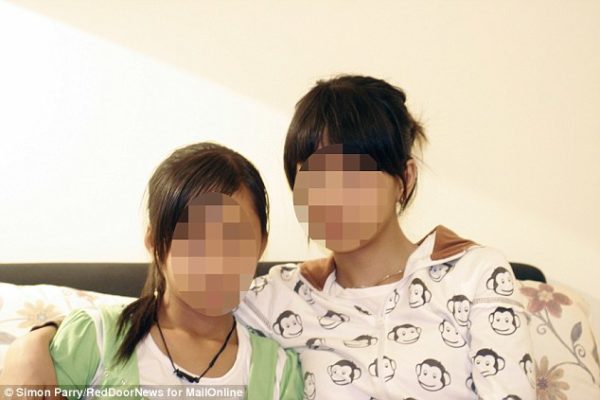 Tormented: D on the left and N on the right: The two Vietnamese girls abused by Gary Glitter. N is a shadow of the bubbly young girl she was before she met the paedophile singer