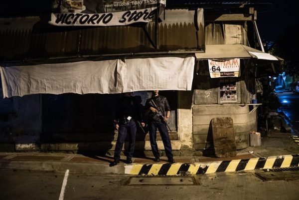 A police officer on a routine patrol in Manila. It is claimed that some police are secretly involved in extrajudicial killings. Photograph: Patrick Tombola