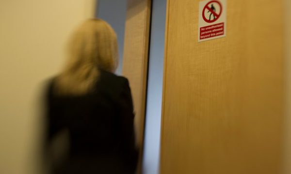 An Internet Watch Foundation analyst enters a room where reported sites are viewed. Photograph: Sean Smith for the Guardian