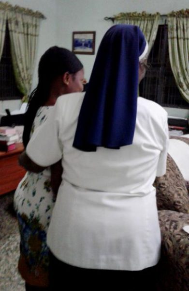Sr. Patricia Ebegbulem, right, with Blessing, a victim of human trafficking at Bakhita Villa in Lagos, Nigeria. GSR has opted not to show Blessing's face to protect her privacy. (Provided photo)