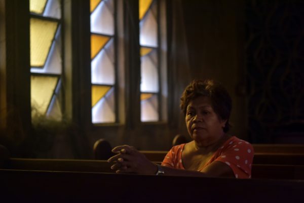 Elena de Chavez, 61, whose transgender daughter Heart was killed Jan. 10 in Navotas City, near Manila, by men believed to be police, meditates Feb. 17, 2017, in Redemptorist Church in Manila, where she and the rest of her family found refuge. (Jes Azna/For The Washington Post)