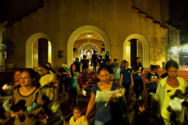 Relatives and friends of victims of extrajudicial killings leave Manila’s Baclaran Church for a vigil Feb. 17, 2017. (Jes Aznar/For The Washington Post)