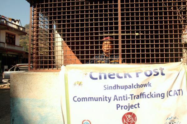 A Nepal Police officer looks out from an anti-trafficking check post in Sundhupalchok