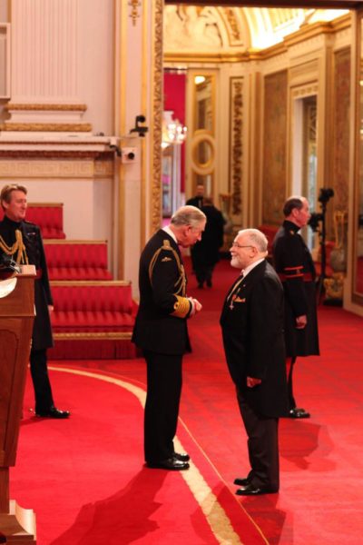 Paedophile Trevor Francis, 71, receiving his medal from Prince Charles at Buckingham Palace in 2012