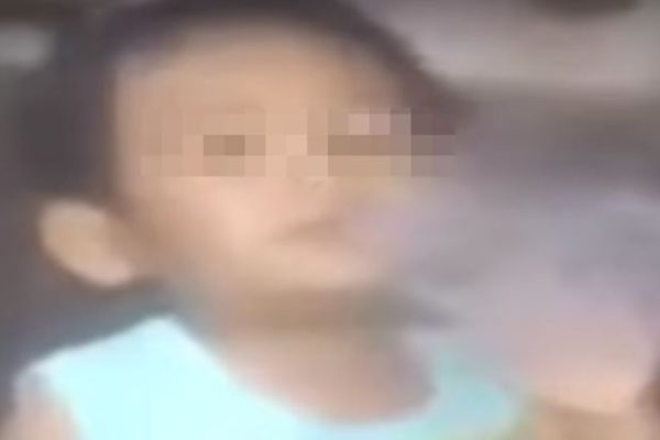A screengrab from a video of the 5-year-old boy smoking shabu. The Star/Asia News Network