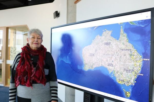 Prof Lyndall Ryan with the map, which took four years to compile
