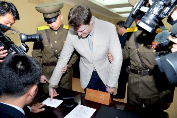 U.S. student Otto Warmbier has his fingerprints taken at North Korea's top court. KCNA / Reuters