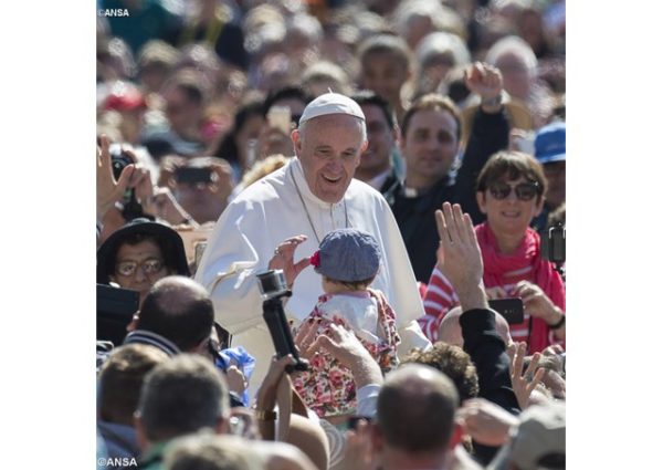 Pope Francis greets a child at a General Audience. On International Missing Children's Day, the Holy Father reminded everyone of the duty to protect children, especially those most at risk. - ANSA