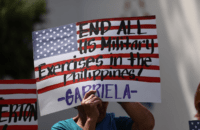 Protesters hold placards at a protest against US-Philippine military exercises on Feb. 21. (Photo: Basilio Sepe/AFP)