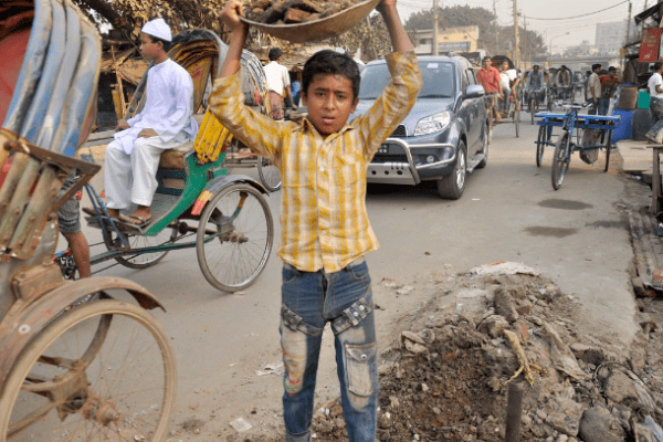 A child worker is employed in road excavation to upgrade utilities in Dhaka, Bangladesh. (Photo: Stephan Uttom/UCA News)