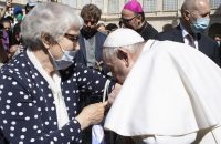 Pope kisses Auschwitz tattoo of Holocaust survivor
