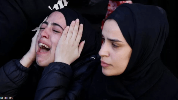 Palestinian teacher shot while giving first aid to militant
