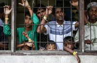This picture taken on Nov. 26 shows recently arrived Rohingya refugees looking on from their shared quarters at a temporary Indonesian immigration shelter in Lhokseumawe, Aceh province.